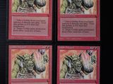 quatre cartes d'un jeu de cartes sur lesquelles figure l'image d'un démon