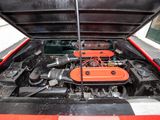 an orange engine in the trunk of a red car