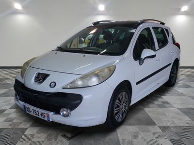 a picture of a small white car parked in a garage