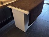 an image of a bench with a brown carpet on it