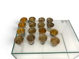 a glass table with cups on top of it