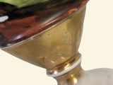a vase with a painting on it sitting on a pedestal