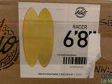 a cardboard box with a yellow surfboard on top of it