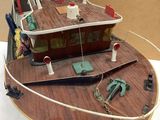 a model of a fishing boat on display on a table