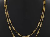 a gold plated necklace with three strands of chain