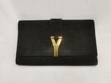 a black purse with a gold y on it