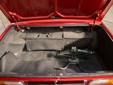 a trunk of a car with a bunch of luggage in it