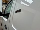 a white truck that is parked in a garage