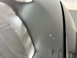 a close up view of a car ' s hood with the hood open