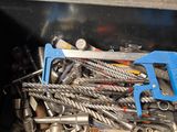 a metal box filled with assorted tools in it