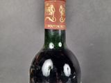 a bottle of wine that is sitting on a table