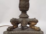 an image of a table lamp with a candle on top of it