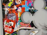 painting of a mickey mouse surrounded by graffiti on a white wall