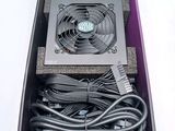 a box with a fan and wires inside of it