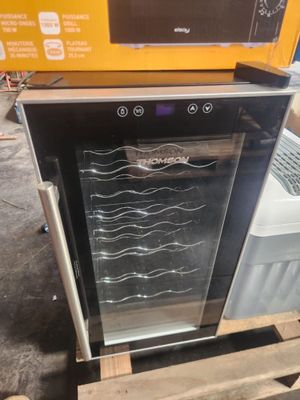 an image of a wine cooler sitting on top of a pallet