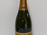 a close up of a bottle of wine on a table