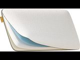 a close up of a pillow on a white surface
