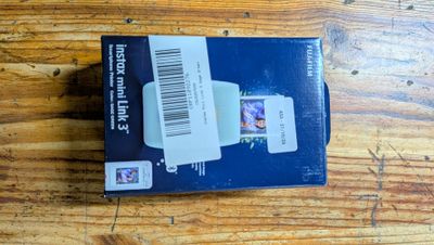 a box with a picture on it sitting on a wooden table