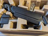 a box that has a gun in it on a table