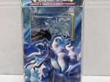 a box of pokemon trading cards featuring a white horse and a blue horse