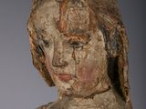an old wooden statue of a woman with a hat on her head