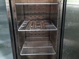 an empty refrigerator with a lot of shelves inside of it