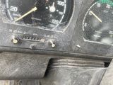 a close up of a car dashboard with a speedometer and gauges