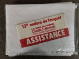 a plastic bag with a sticker on it that says assistance