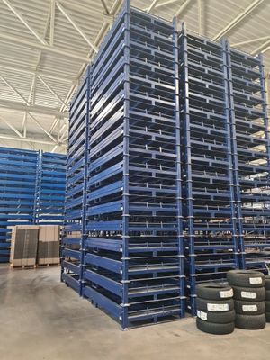 pallet racking in a warehouse with tires stacked on top of each other