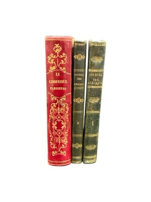 three books are stacked on top of each other on a white surface