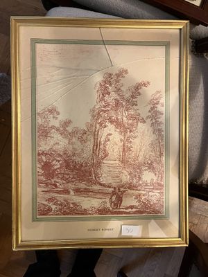 une photo d'un tableau représentant un paysage, dans un cadre doré