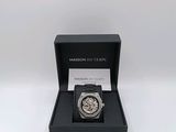the watch is in a black box on a white surface