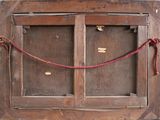 an old wooden window with a rope around it