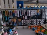 many rolls of thread and spools of yarn on the table