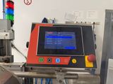 an image of a machine that is working on a piece of machinery