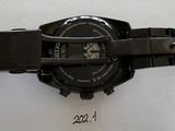 the watch is black and has a black band around the wrist