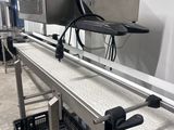 an image of a conveyor belt with a computer on it