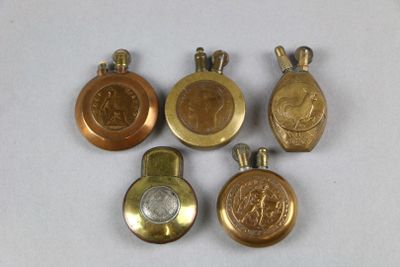 four gold and silver lockes with medallions on them on a white surface