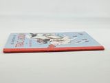 an old children ' s book sitting on top of a white table