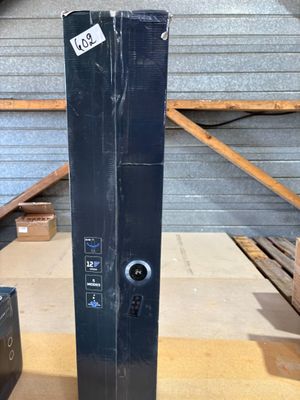an image of a black computer on a wooden table