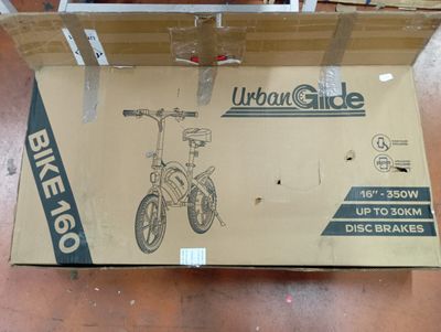a cardboard box with a bike on it on the floor