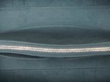 the inside of a blue purse with a zipper on it