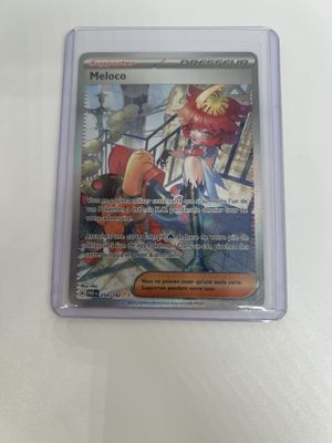 a close up of a pokemon card on a table