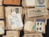 many old papers and old books on a black table