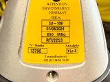 a close up of a yellow and black sign on a metal object