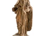 an old statue of a woman holding a child on a pedestal