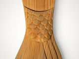 wooden fish tail on a white background with a gray background