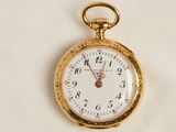 a gold pocket watch with a white face on a white background