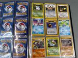 a lot of pokemon cards sitting on a table