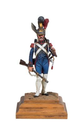 the figurine of a soldier with a sword and a hat